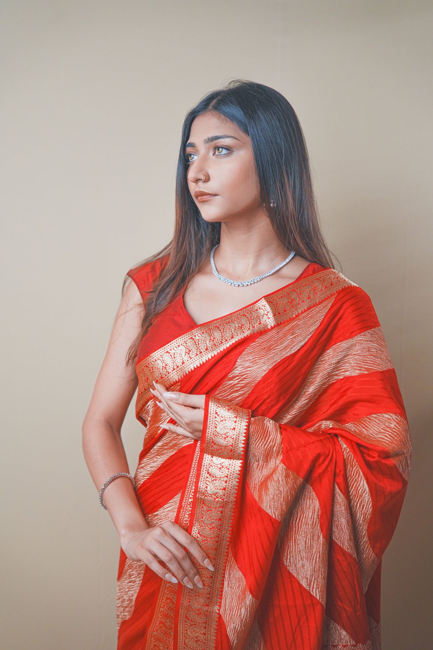 Radiant Red Crepe Silk Saree Featuring Detailed Zari Work