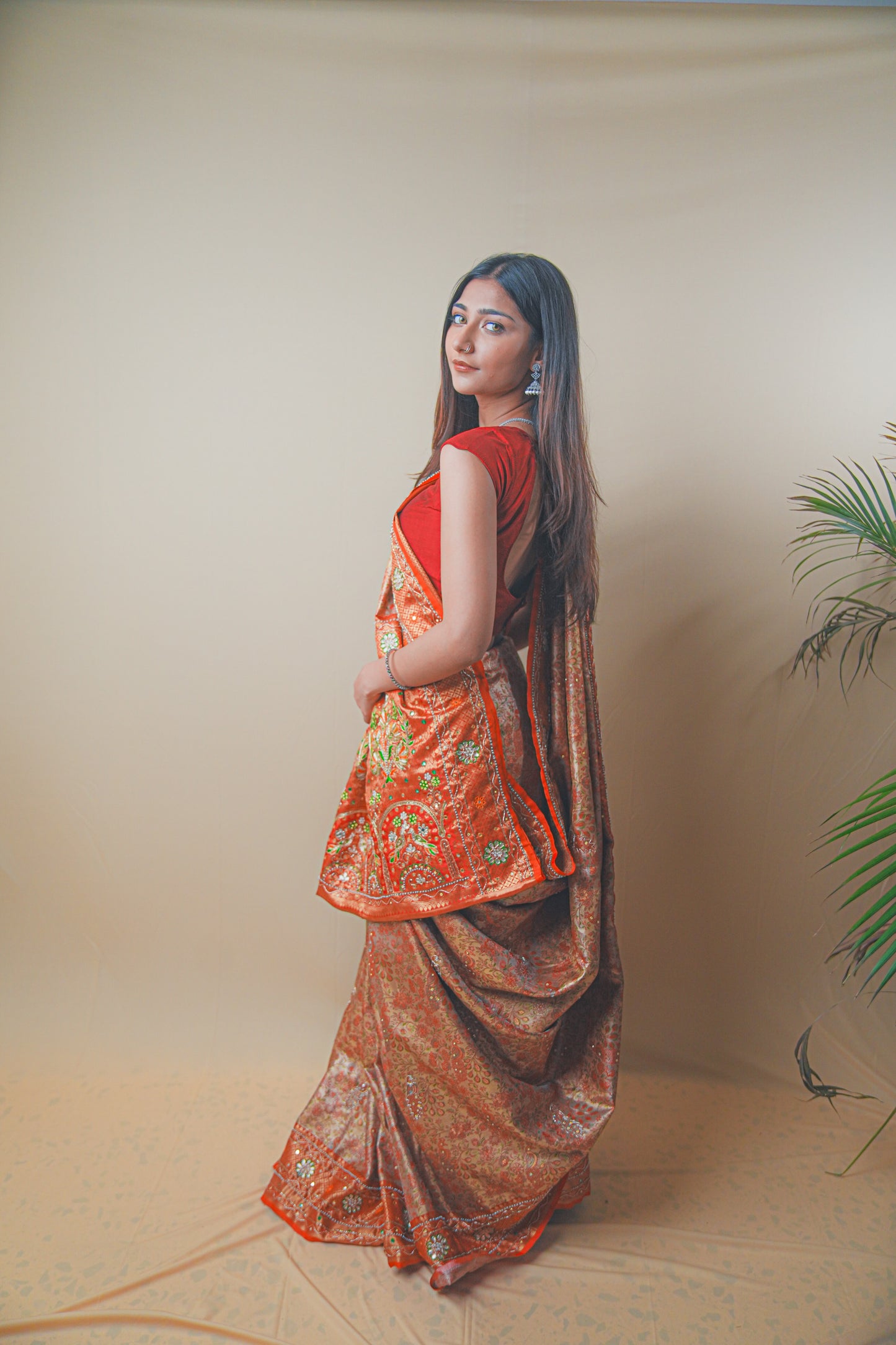 Rust Orange Kanjeevaram Silk Saree with Elegant Kundan Work