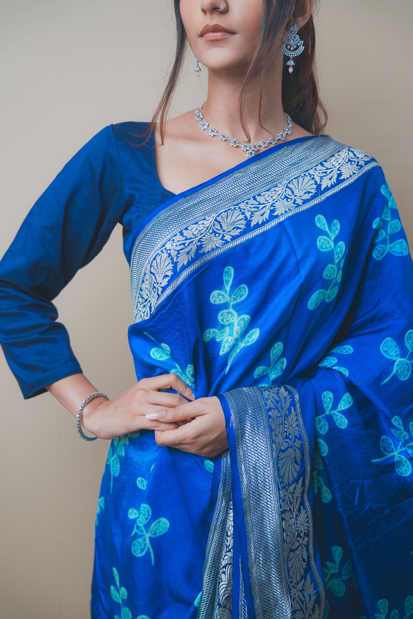 Elegant Blue Satin Silk Saree Featuring Silver Zari and Printed Patterns