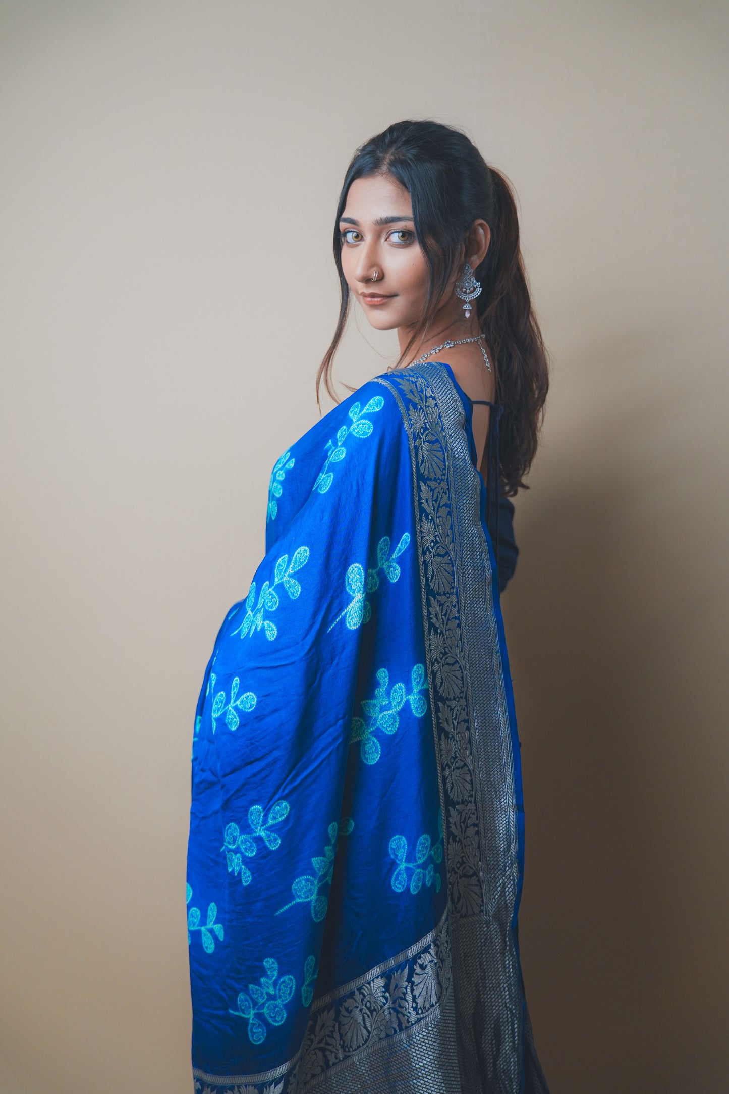 Elegant Blue Satin Silk Saree Featuring Silver Zari and Printed Patterns