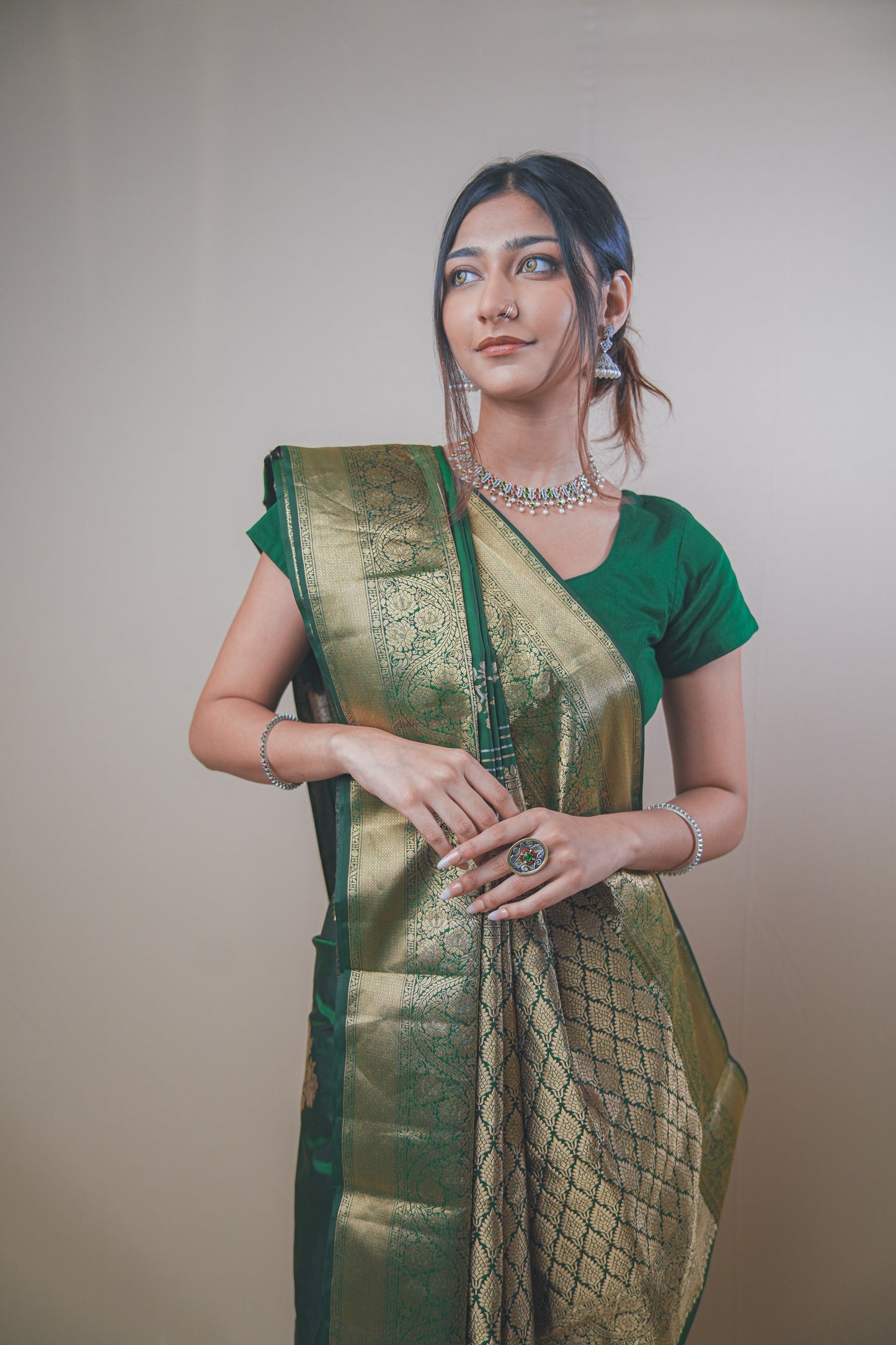 Traditional Green Kanjivaram Silk Saree Featuring Detailed Zari Work