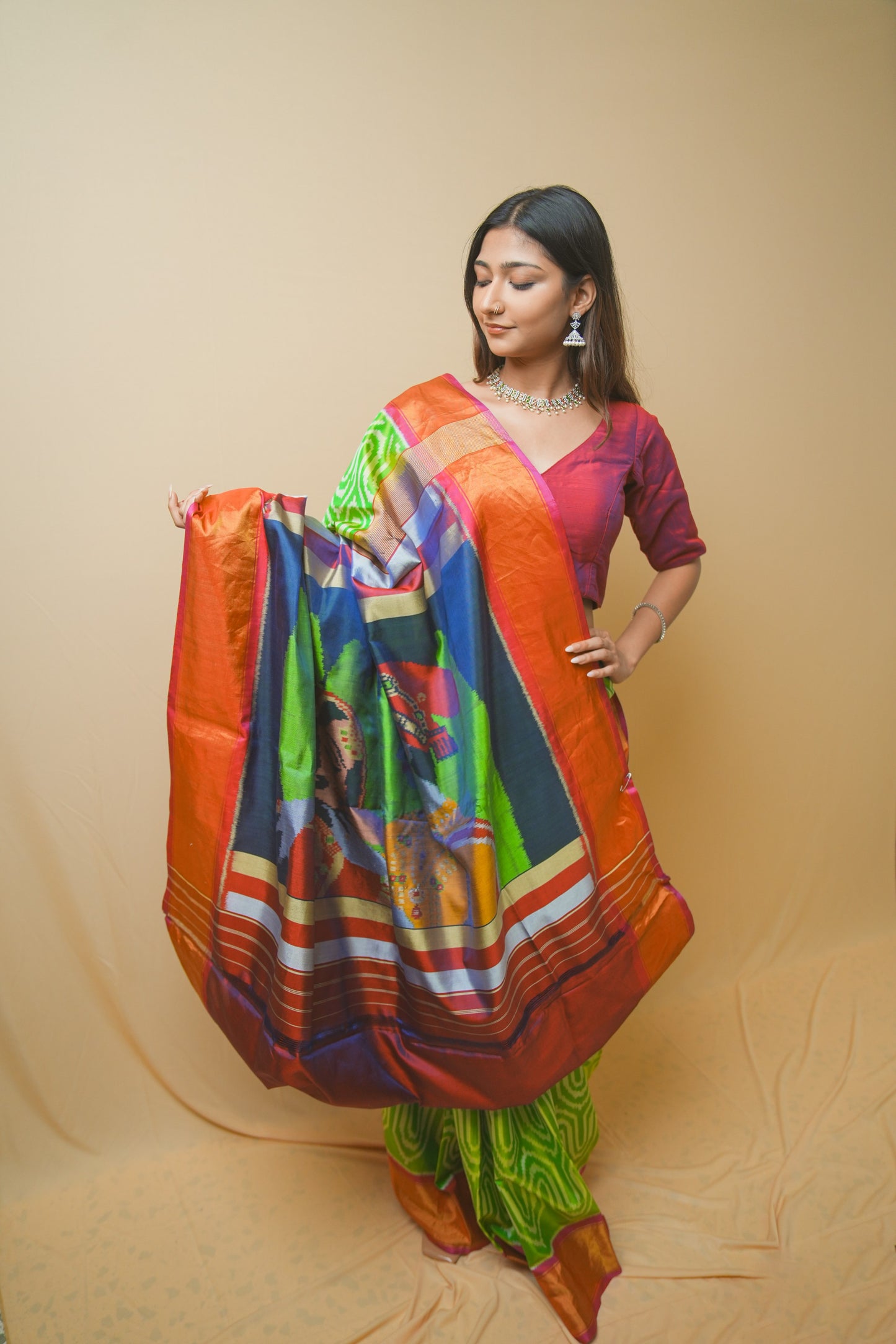 Rajkoti Patola Silk Saree Featuring Bold Designer Pallu and Contrast Green Ikat