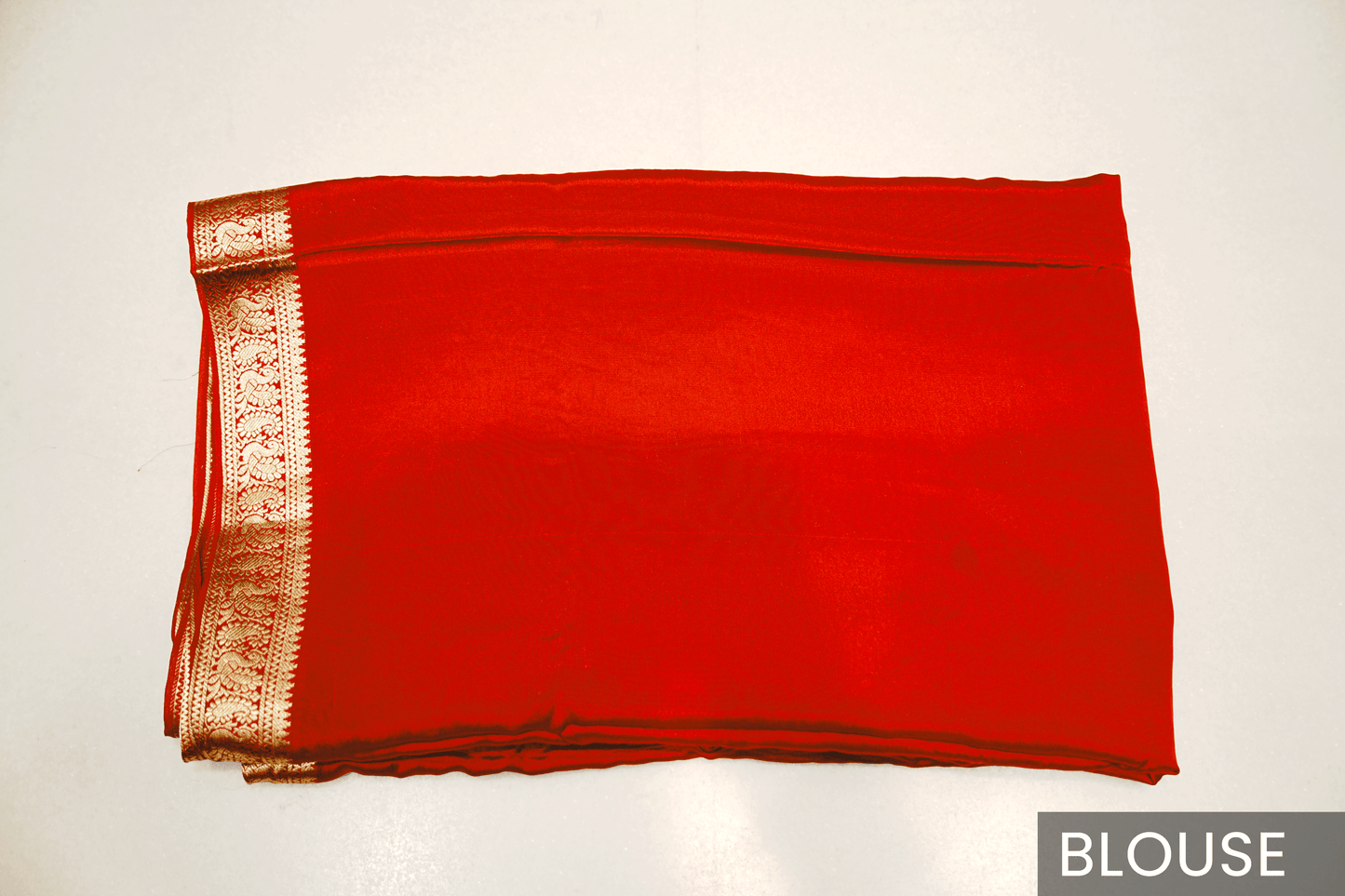 Radiant Red Crepe Silk Saree Featuring Detailed Zari Work