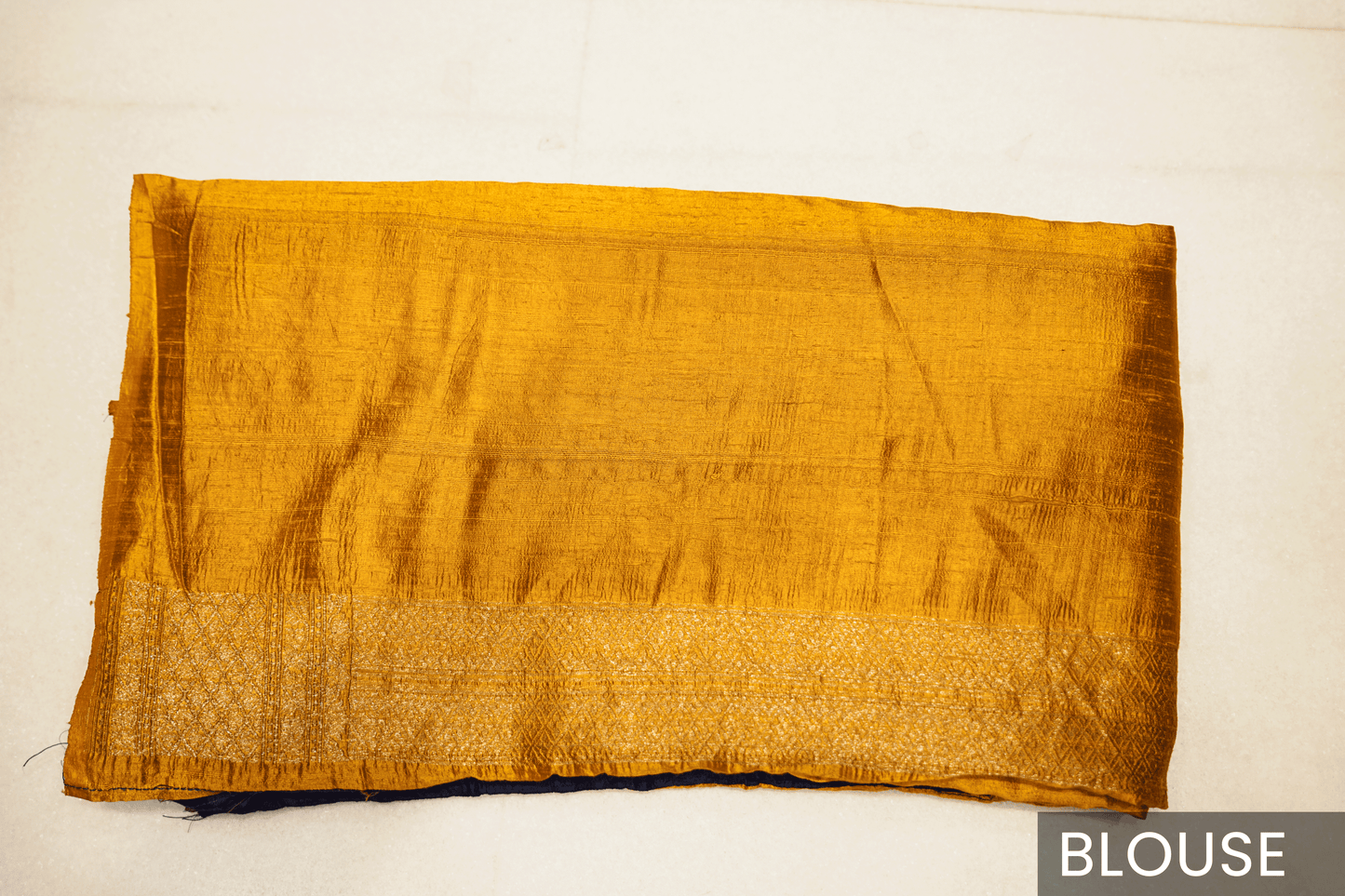 Pink Banarasi Raw Silk Saree with Golden Zari Work and Contrasting Blue-Yellow Border