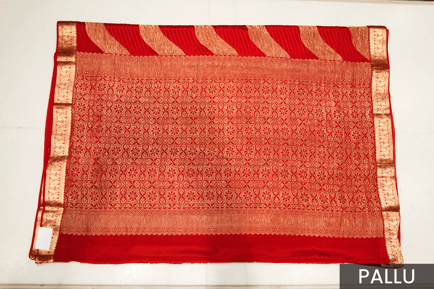 Radiant Red Crepe Silk Saree Featuring Detailed Zari Work