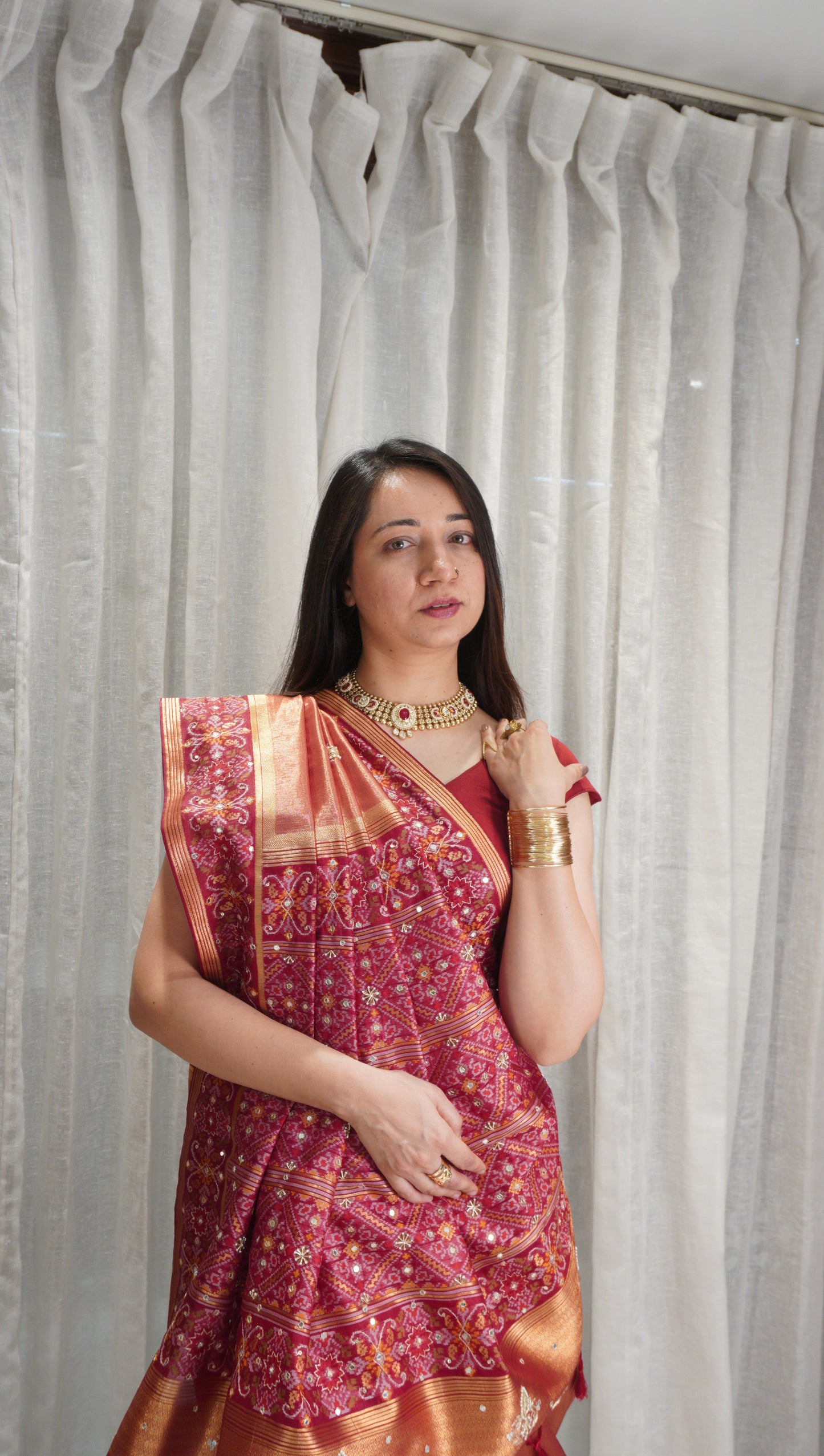 Rust Royal Tissue Silk Saree with Zardozi Work & Patola Border