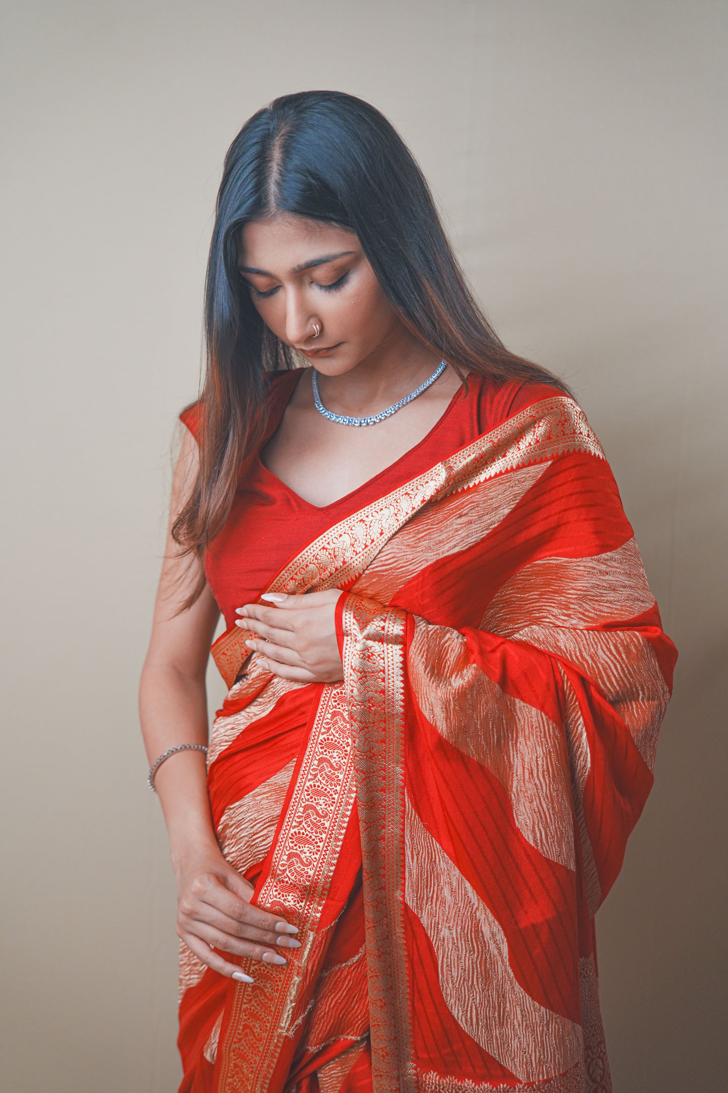 Radiant Red Crepe Silk Saree Featuring Detailed Zari Work