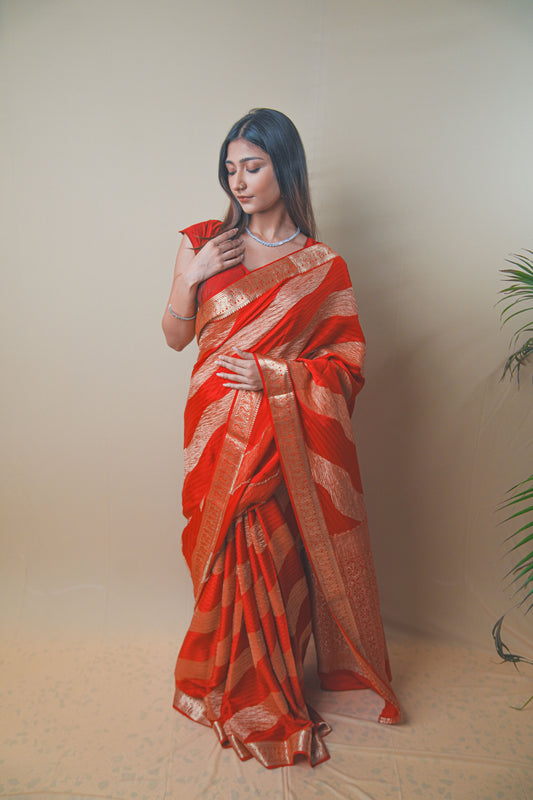 Radiant Red Crepe Silk Saree Featuring Detailed Zari Work