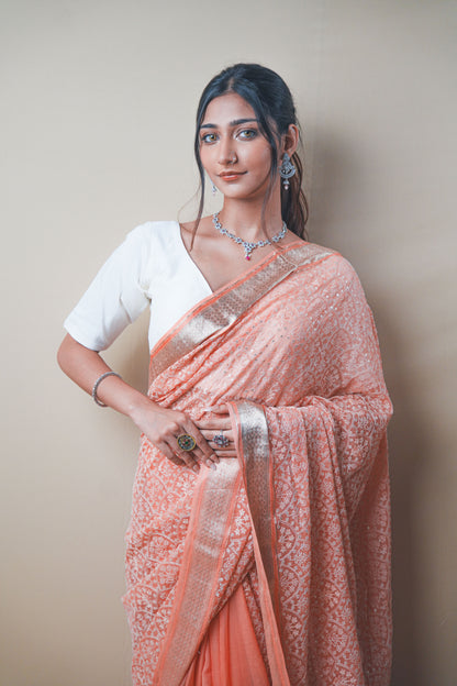 Graceful Peach Chiffon Saree with Resham Thread Embroidery & Golden Zari Border