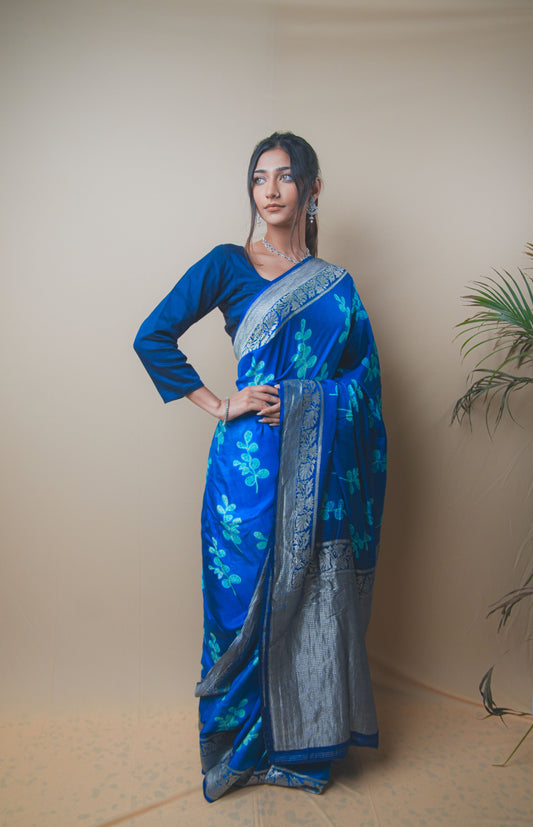 Elegant Blue Satin Silk Saree Featuring Silver Zari and Printed Patterns