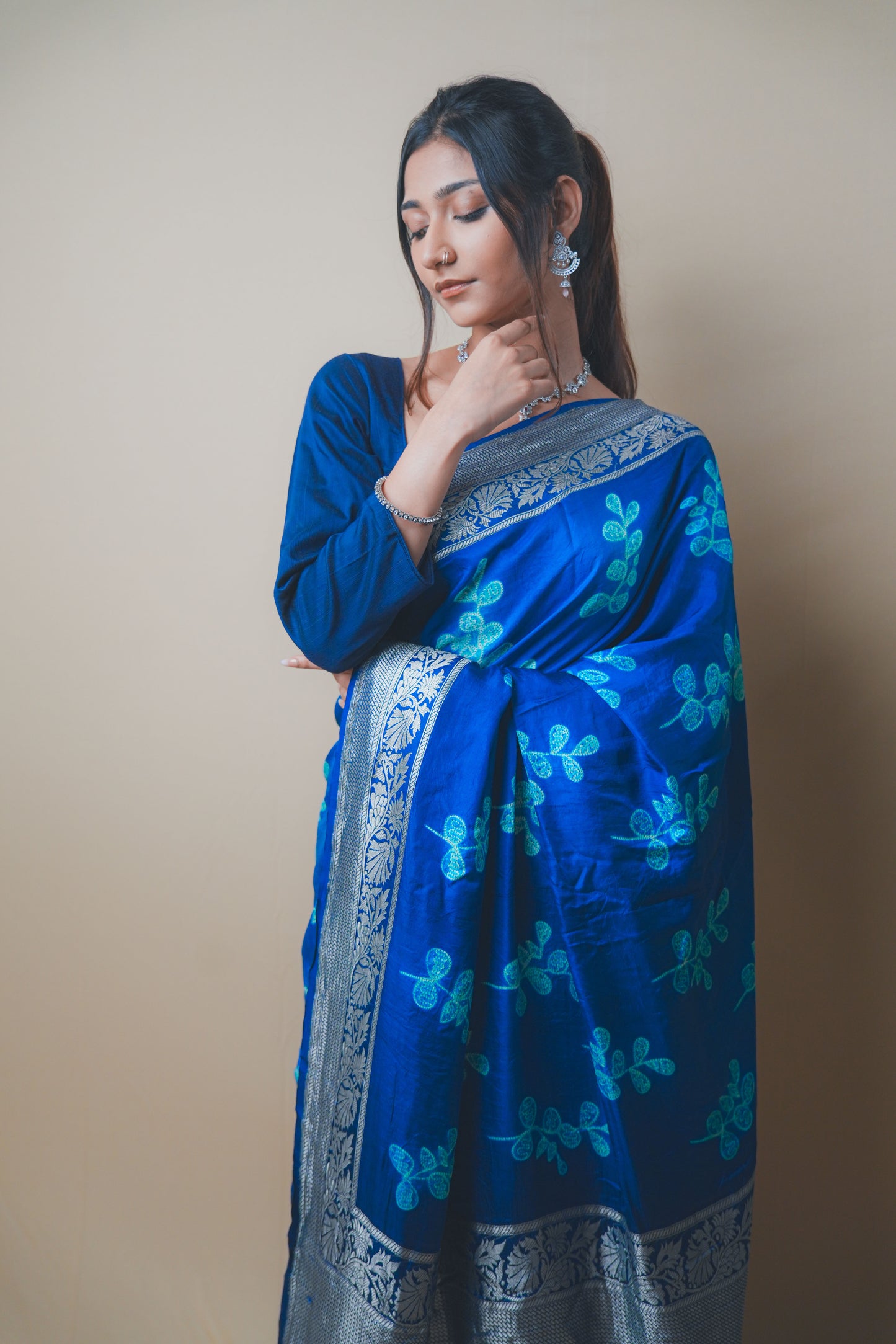Elegant Blue Satin Silk Saree Featuring Silver Zari and Printed Patterns
