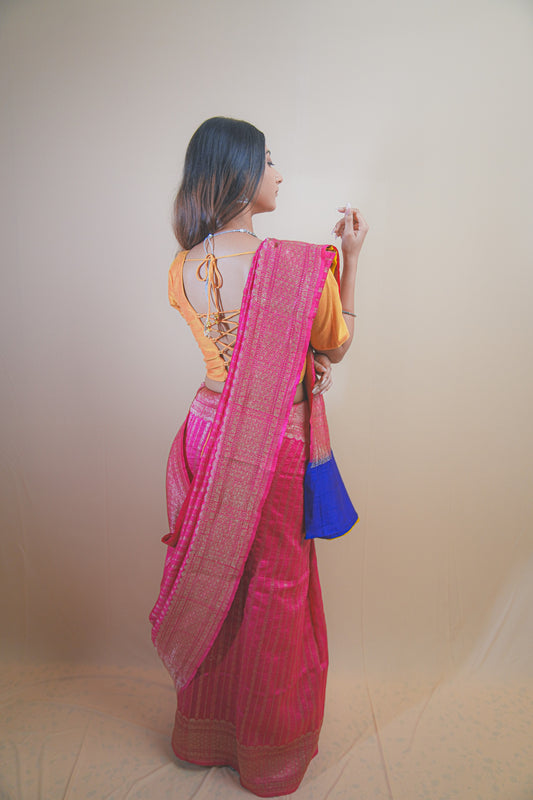 Pink Banarasi Raw Silk Saree with Golden Zari Work and Contrasting Blue-Yellow Border