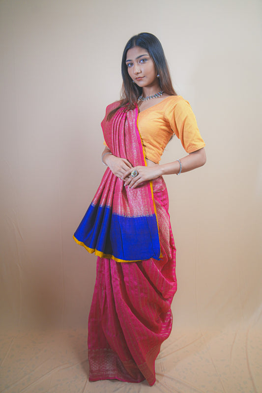 Pink Banarasi Raw Silk Saree with Golden Zari Work and Contrasting Blue-Yellow Border