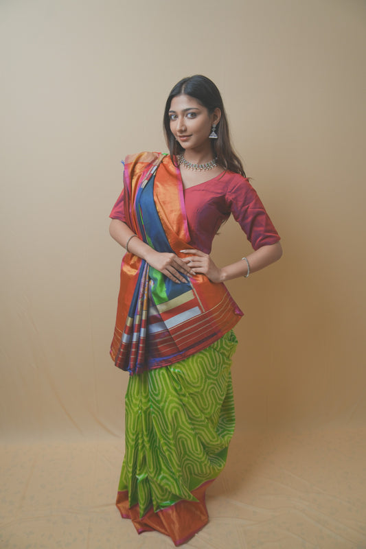 Rajkoti Patola Silk Saree Featuring Bold Designer Pallu and Contrast Green Ikat