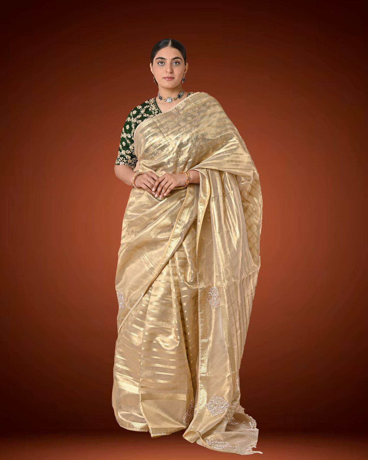 Gold Tissue Silk Saree with Jardosi and Diamond Embellishment & Green Embroidered Blouse