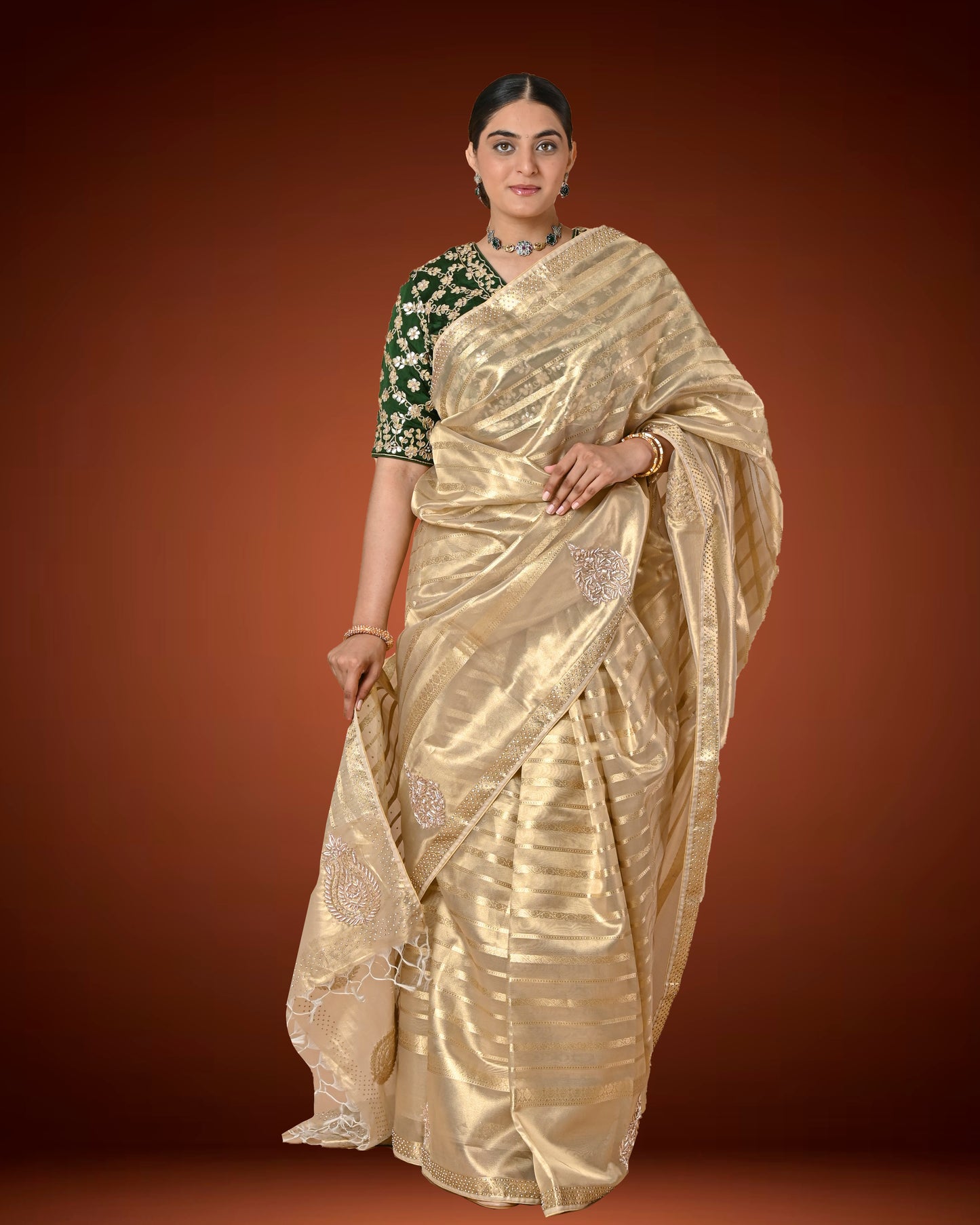 Gold Tissue Silk Saree with Jardosi and Diamond Embellishment & Green Embroidered Blouse