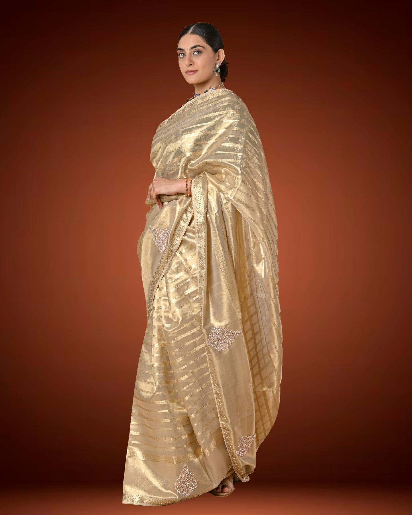 Gold Tissue Silk Saree with Jardosi and Diamond Embellishment & Green Embroidered Blouse
