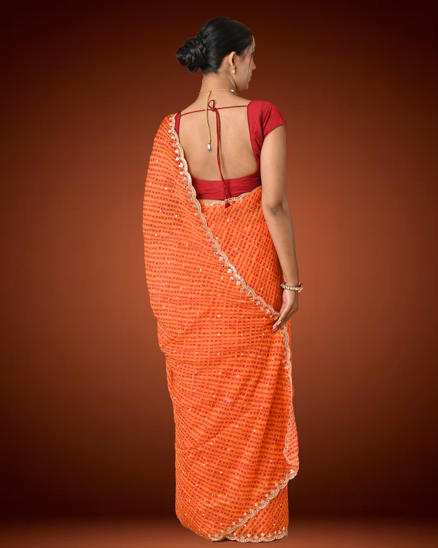 Orange Crape Georgette Leheriya Saree with Mirror Work Border