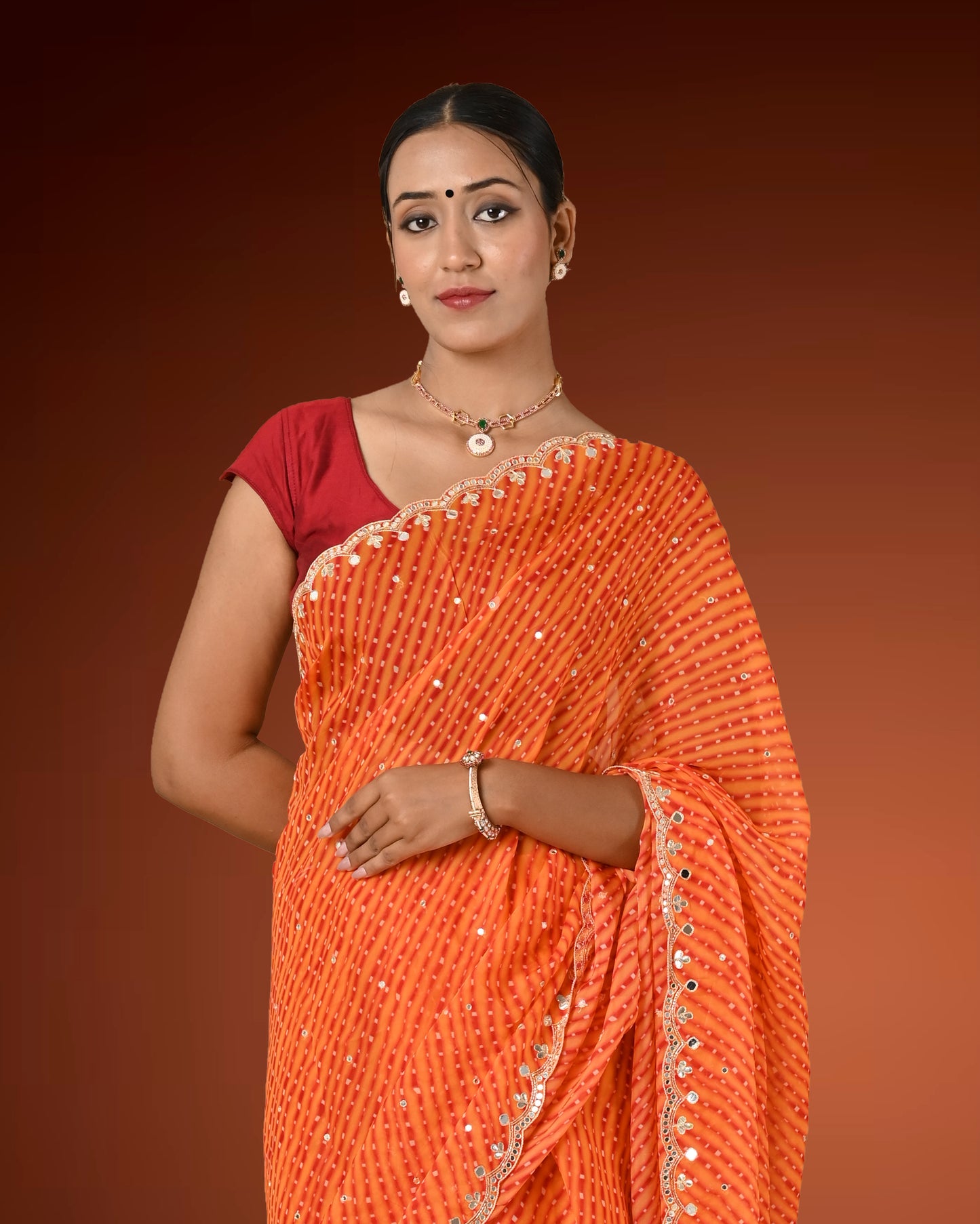 Orange Crape Georgette Leheriya Saree with Mirror Work Border