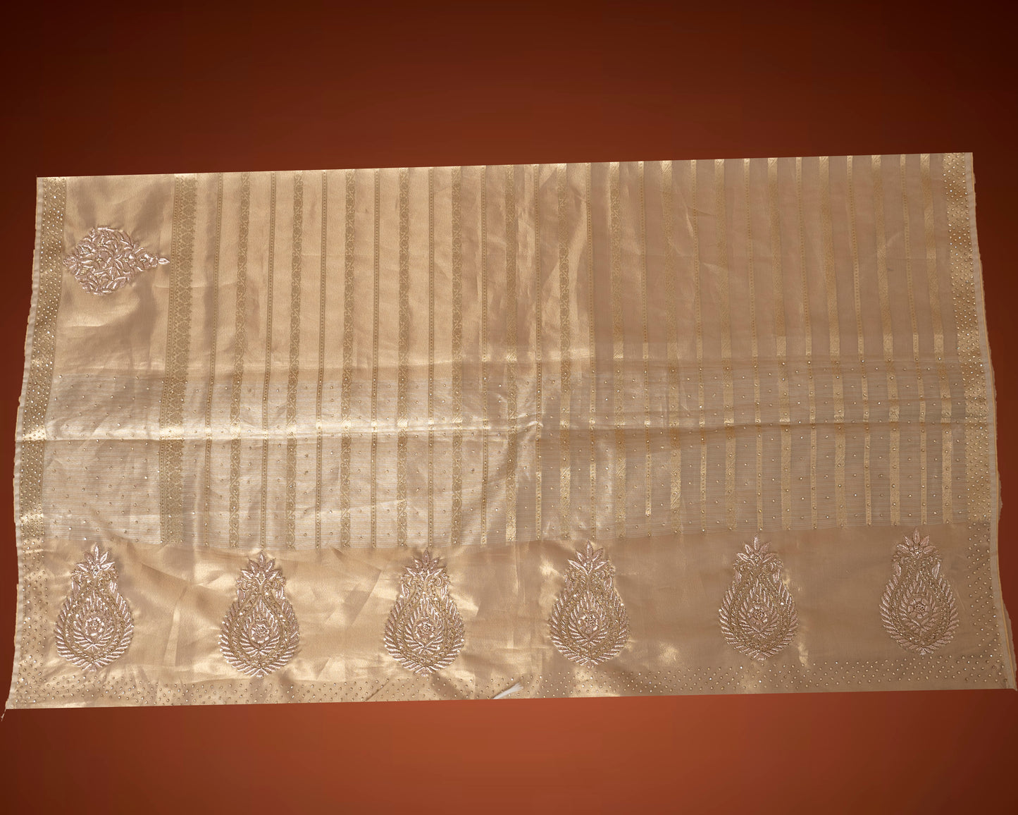 Gold Tissue Silk Saree with Jardosi and Diamond Embellishment & Green Embroidered Blouse